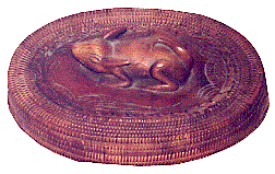 [Oval, rattan basket with carved wooden rabbit-like decoration on the lid: 15k]