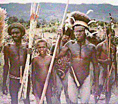 [A group of Dani warriors with bows and arrows, white body paint on the road between Jiwika Market and Wamena, Papua (Irian Jaya), Indonesia: 29k]
