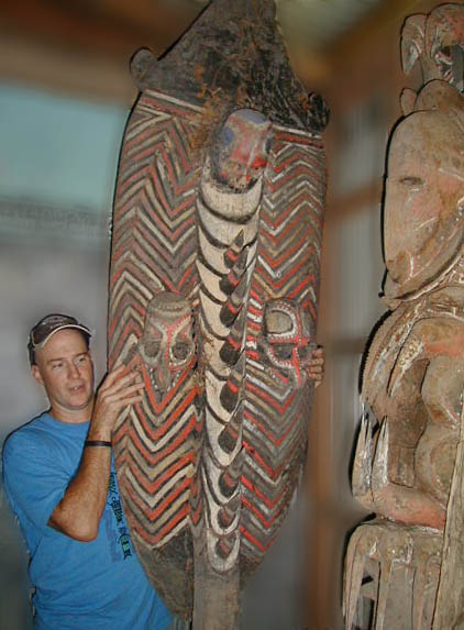 [Doug Mehaffey checking out New Guinea Waskuk and Abelam statues in a Wewak collection: 60k]
