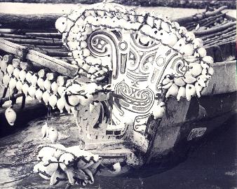 [Detail of Trobriand canoe prow splashboard showing carving and double edging of cowry shells: 32k]